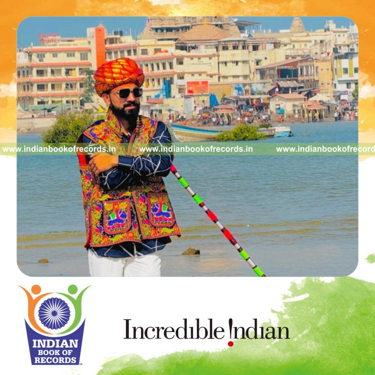 Individual performing fast wooden stick spins using one hand recognized by Indian Book of Records