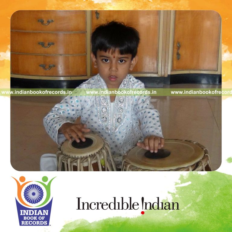young male playing tabla instrument for record recognition in Indian Book of Records